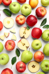 Photo of Flat lay composition with whole and cut apples on white background