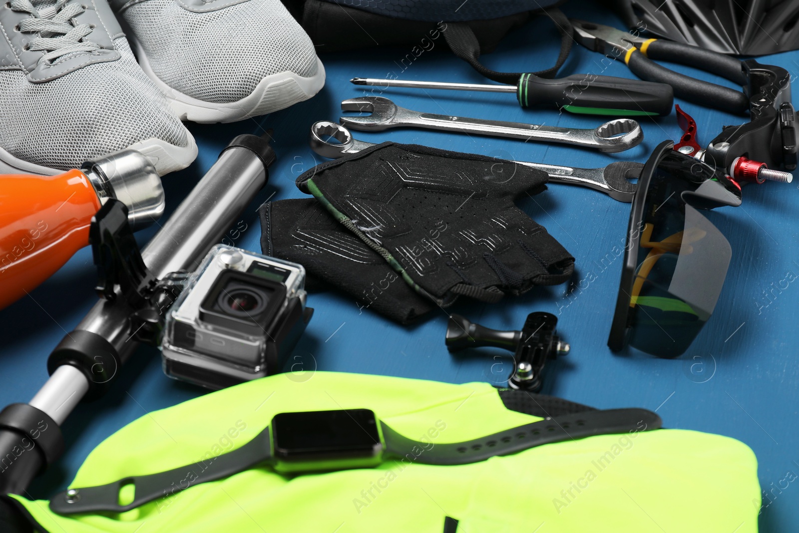 Photo of Bicycle accessories and tools on blue wooden table