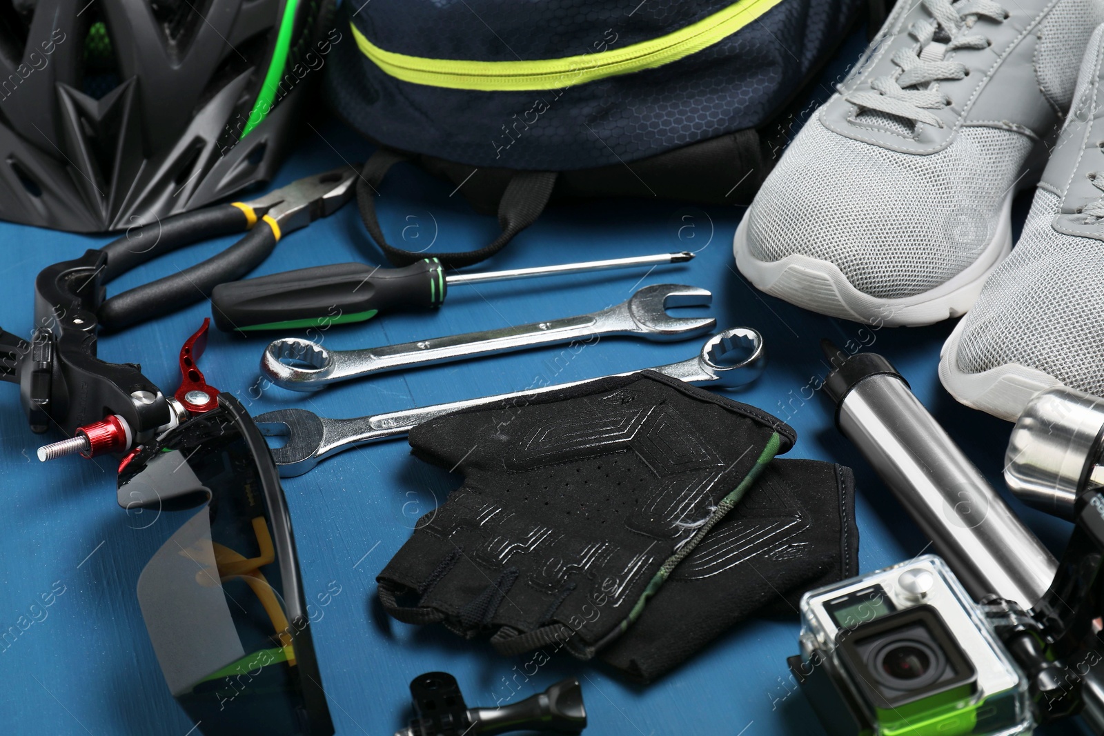 Photo of Bicycle accessories and tools on blue wooden table