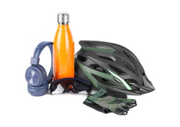 Bicycle helmet, accessories, thermo bottle and headphones isolated on white