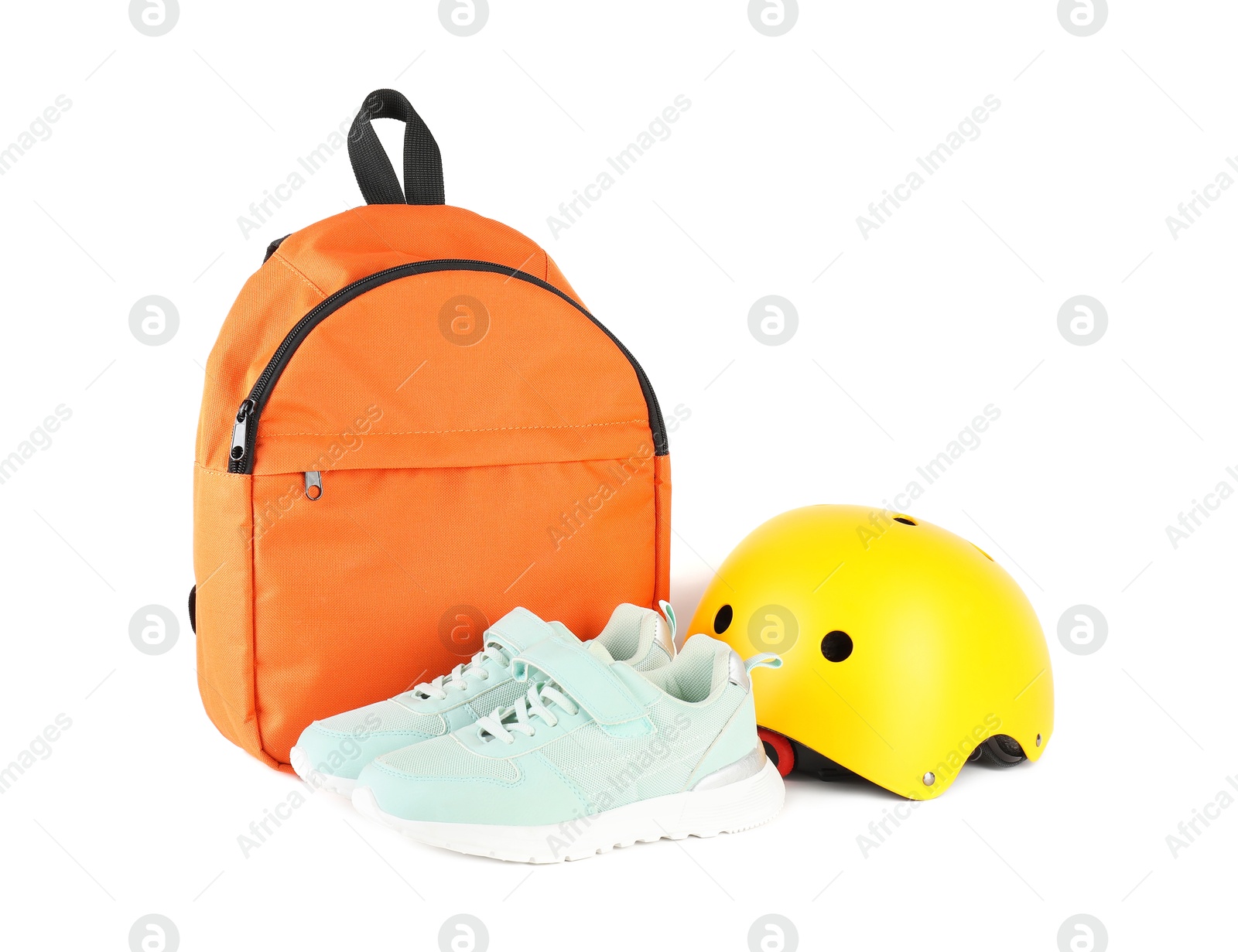 Photo of Bicycle helmet, sneakers and backpack isolated on white