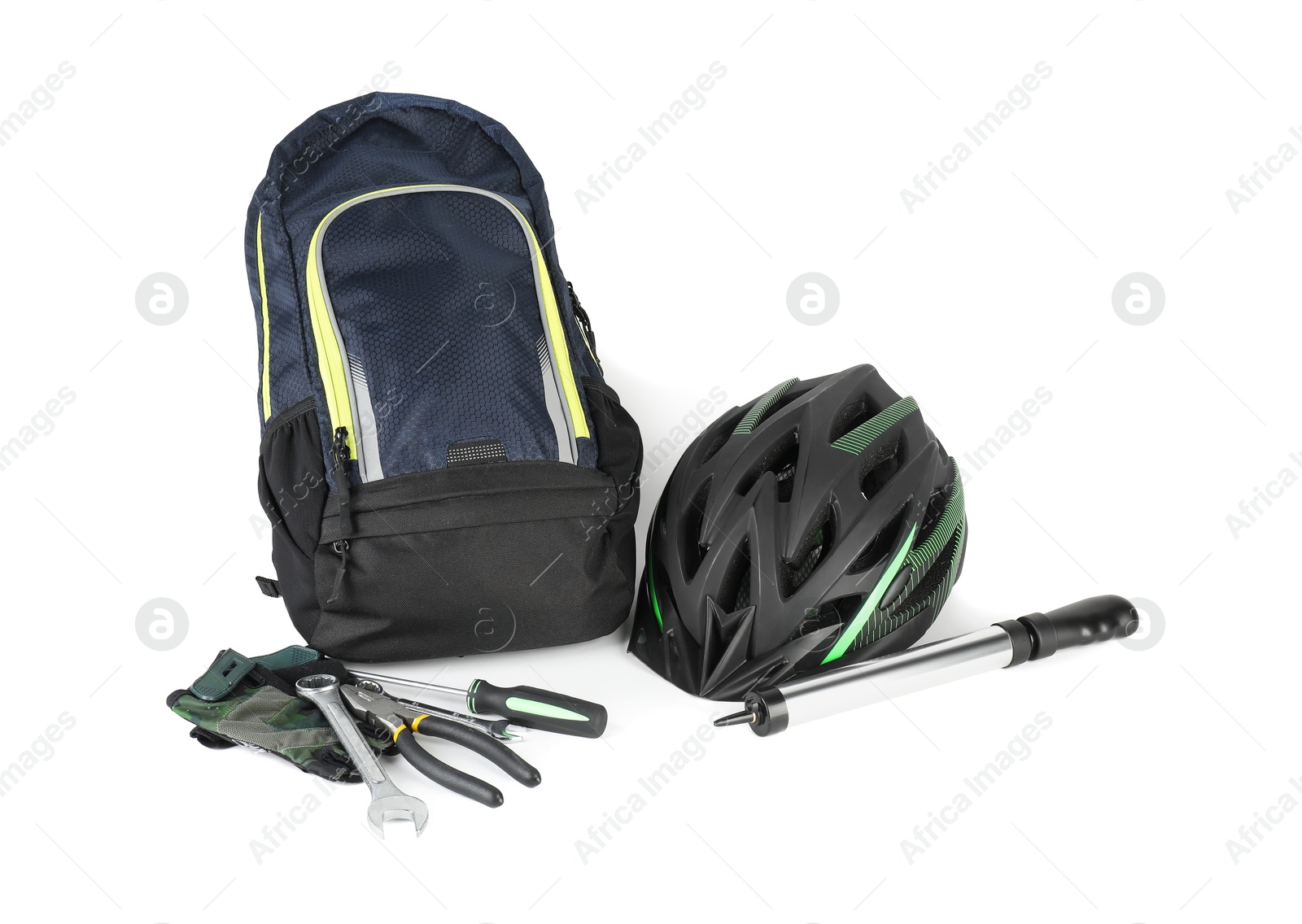 Photo of Bicycle helmet, backpack, fingerless gloves and tools isolated on white