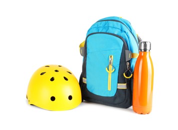 Bicycle helmet, thermo bottle and backpack isolated on white