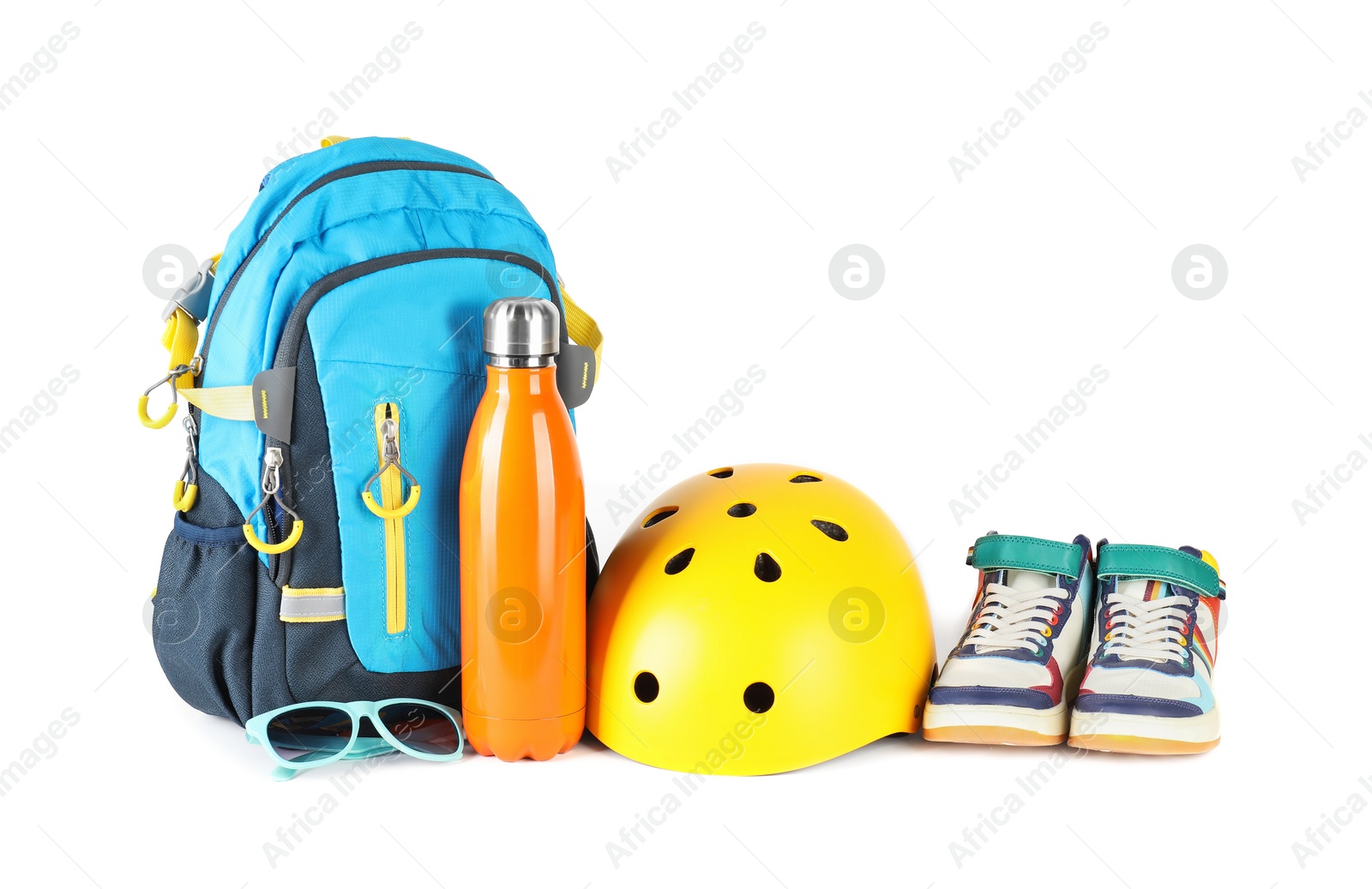 Photo of Bicycle helmet, thermo bottle, sneakers, sunglasses and backpack isolated on white