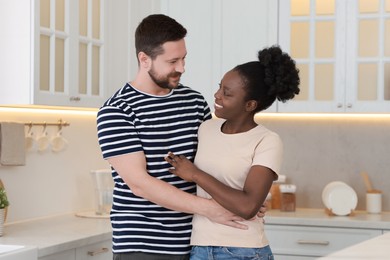 International relationships. Portrait of lovely couple in kitchen