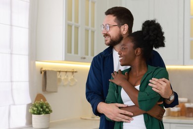 International relationships. Portrait of lovely couple in kitchen