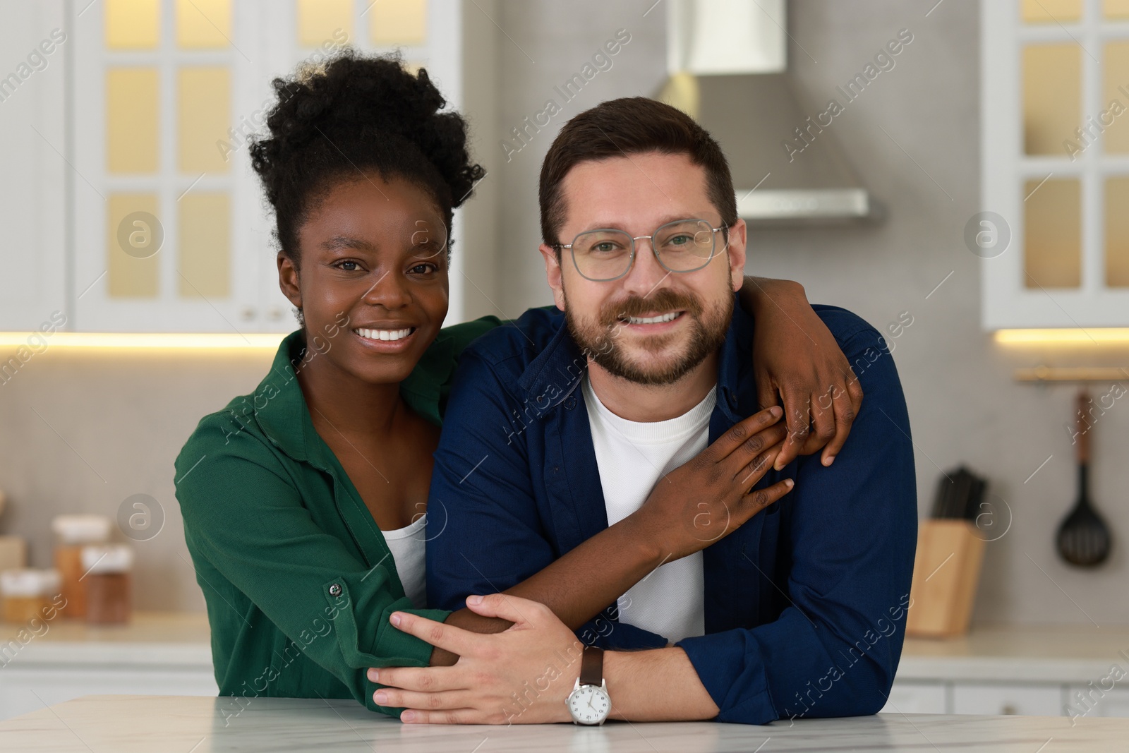 Photo of International relationships. Portrait of lovely couple in kitchen