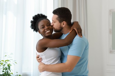 International relationships. Portrait of lovely couple at home