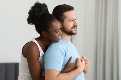 International relationships. Portrait of lovely couple at home