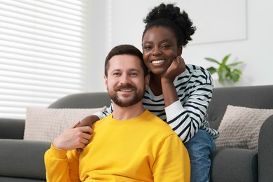 Photo of International relationships. Portrait of lovely couple at home