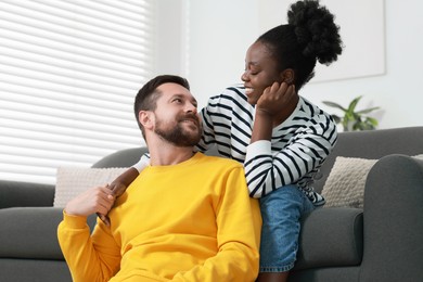 Photo of International relationships. Portrait of lovely couple at home