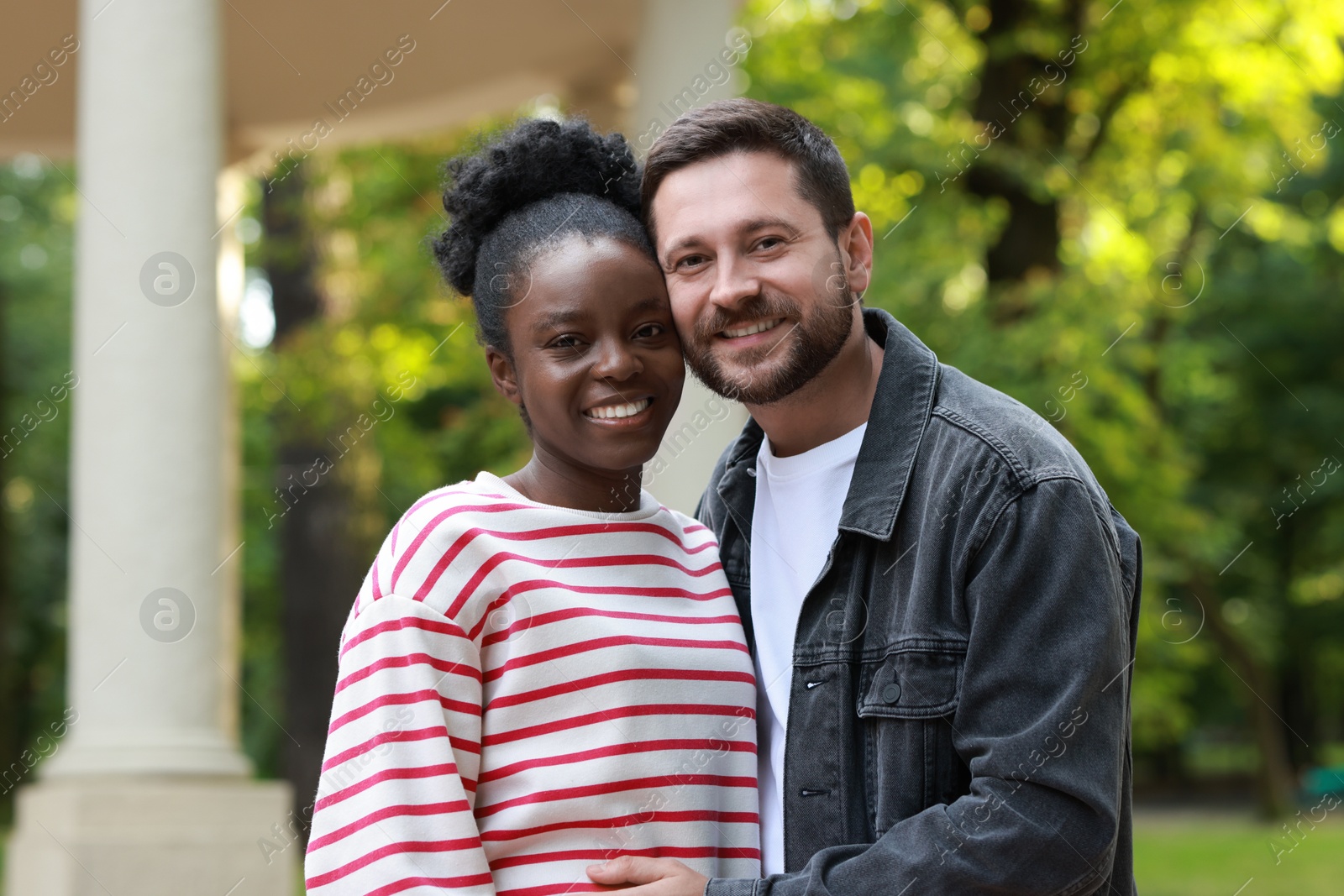 Photo of International relationships. Portrait of lovely couple outdoors