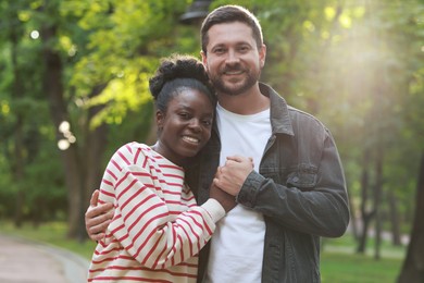 International relationships. Portrait of lovely couple outdoors