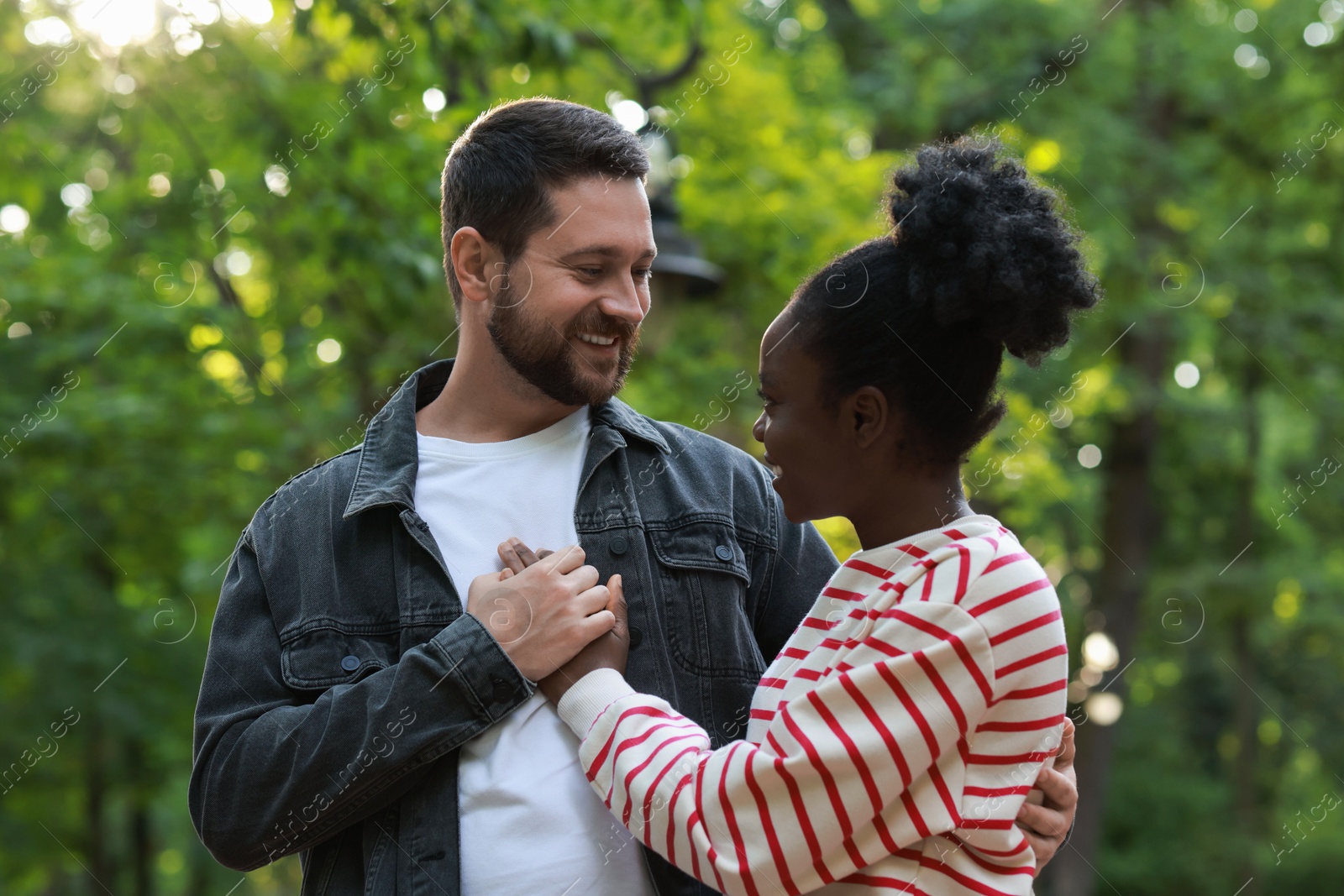 Photo of International relationships. Portrait of lovely couple outdoors