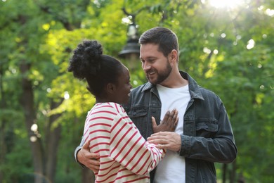 International relationships. Portrait of lovely couple outdoors