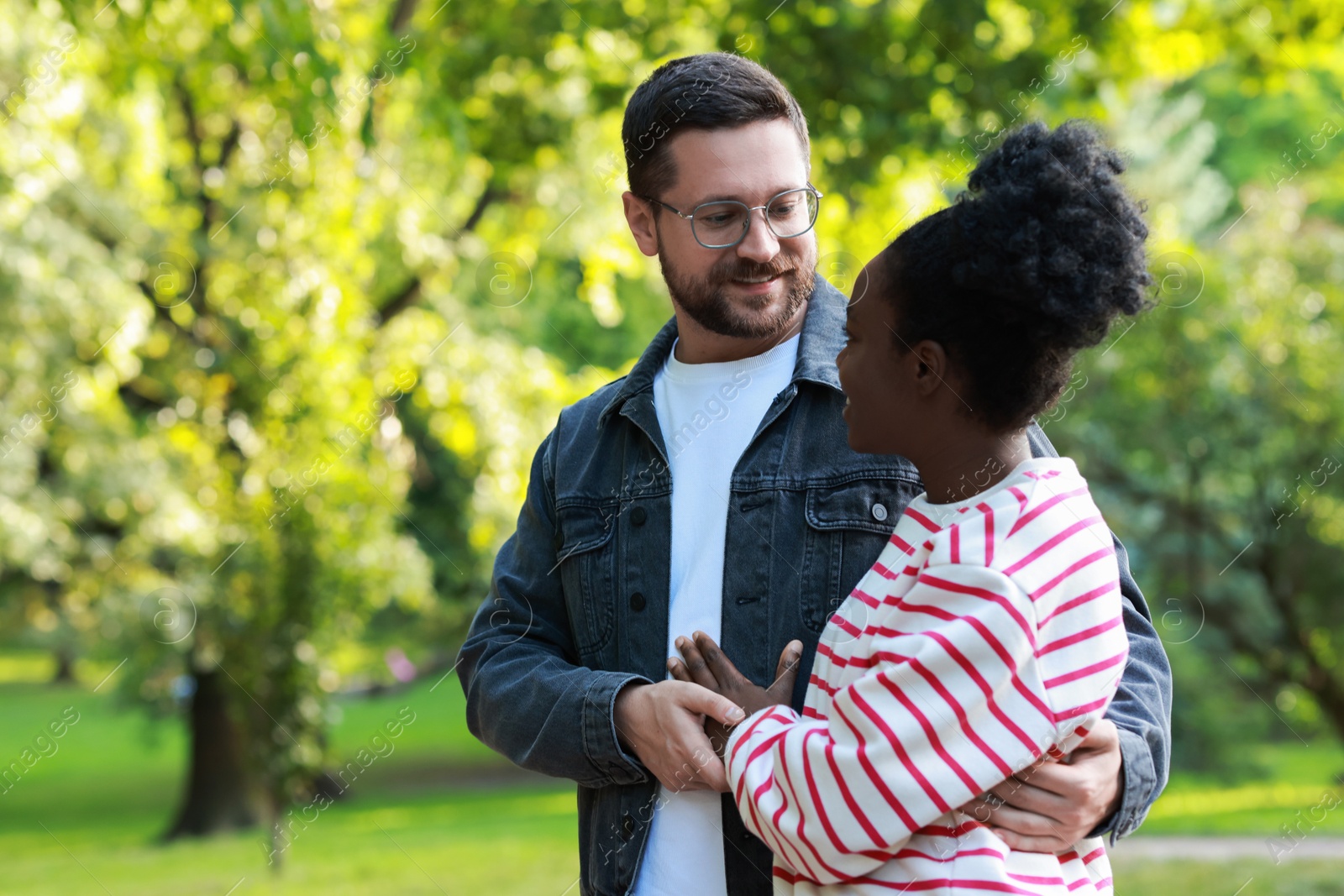 Photo of International relationships. Portrait of lovely couple outdoors, space for text