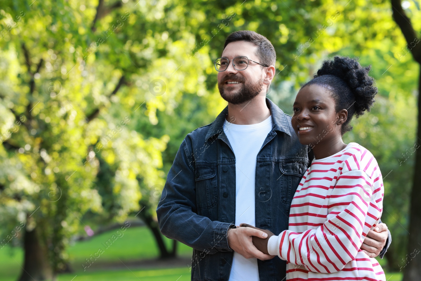 Photo of International relationships. Portrait of lovely couple outdoors, space for text