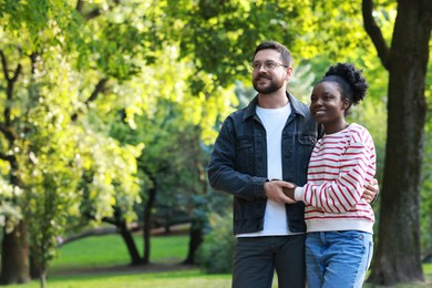 Photo of International relationships. Portrait of lovely couple outdoors, space for text