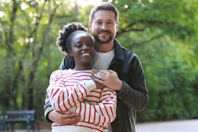 International relationships. Portrait of lovely couple outdoors