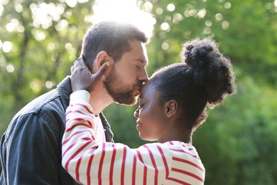 International relationships. Portrait of lovely couple outdoors