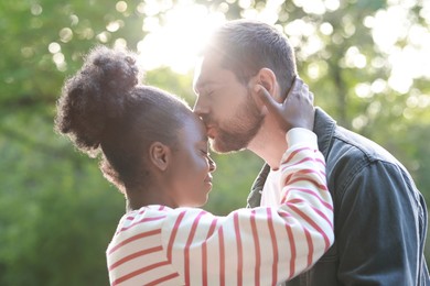 International relationships. Portrait of lovely couple outdoors