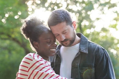 International relationships. Portrait of lovely couple outdoors