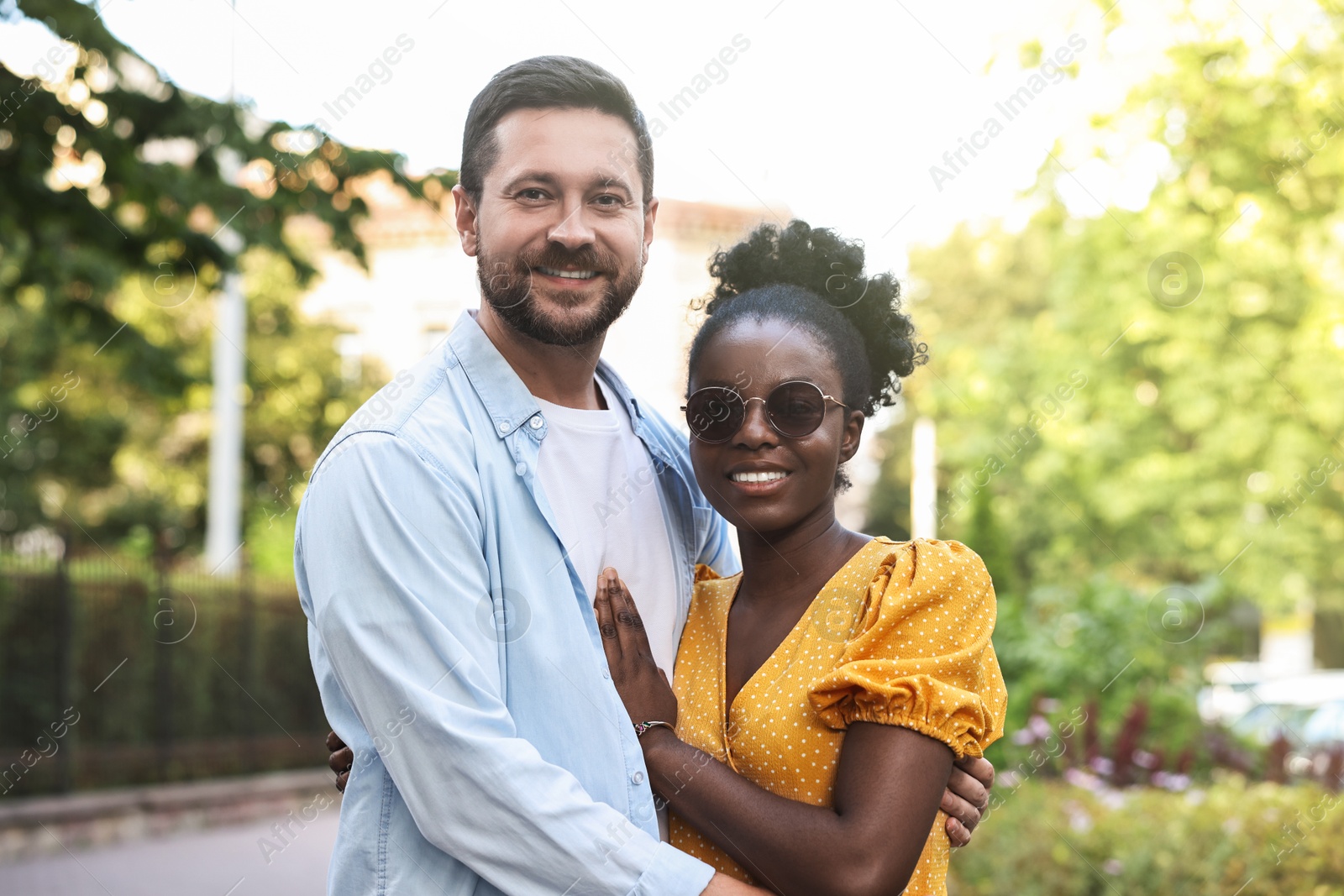 Photo of International relationships. Portrait of lovely couple outdoors