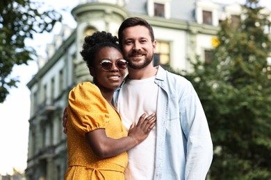 Photo of International relationships. Portrait of lovely couple outdoors