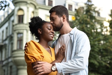 International relationships. Portrait of lovely couple outdoors