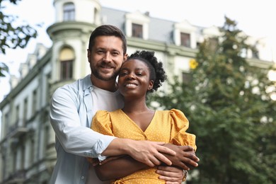 Photo of International relationships. Portrait of lovely couple outdoors