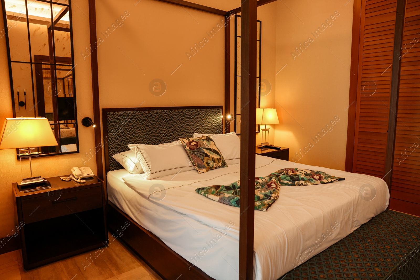 Photo of Comfortable large bed in stylish hotel room