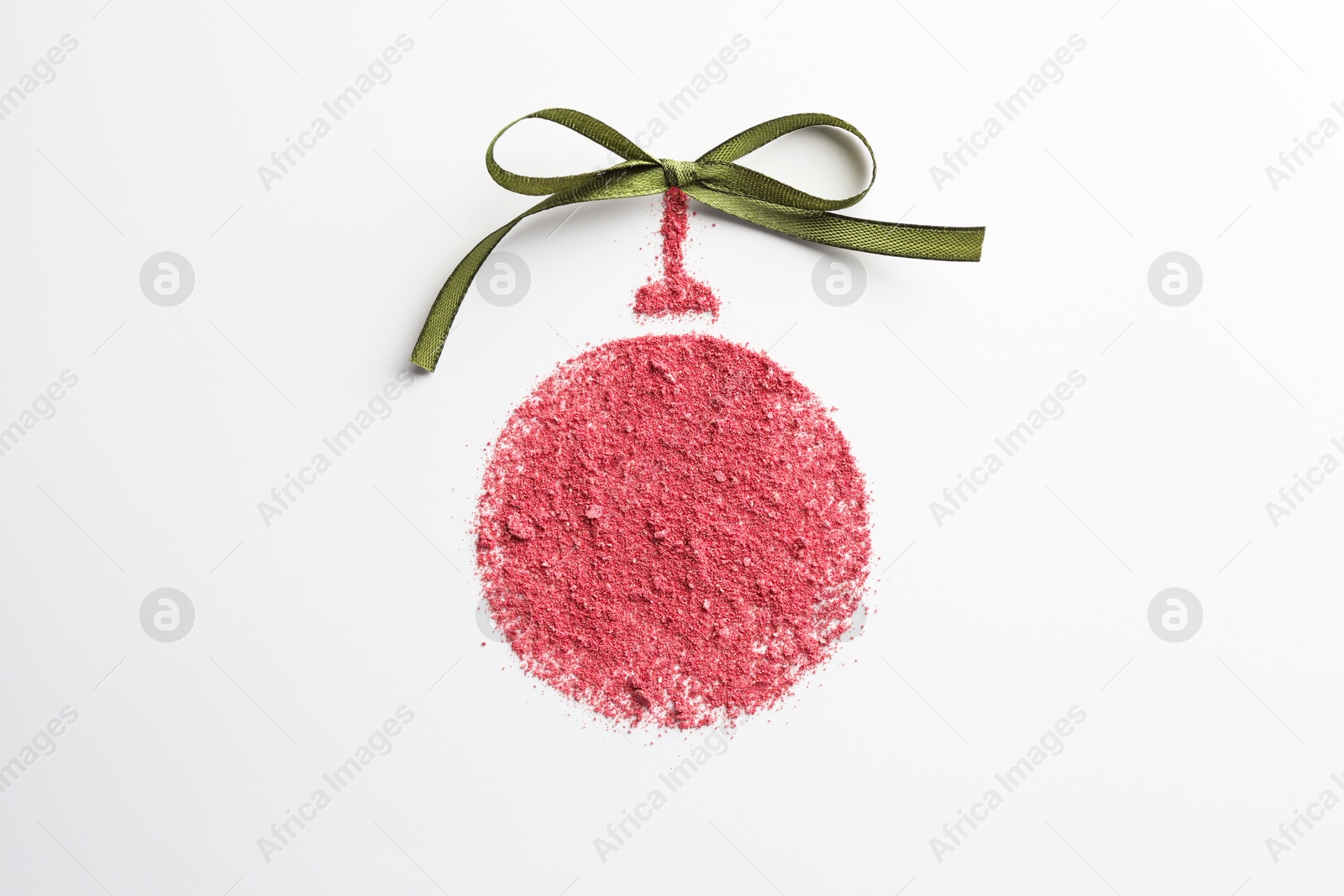 Photo of Christmas ball made of blush with bow on white background, top view