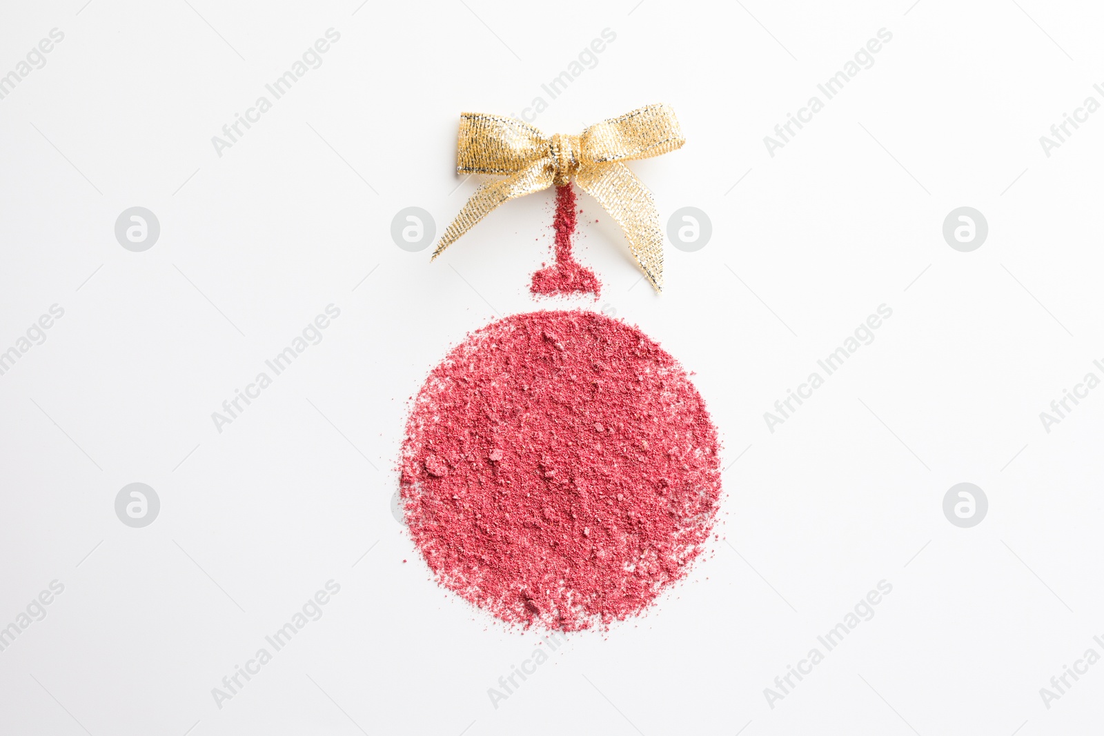 Photo of Christmas ball made of blush with bow on white background, top view