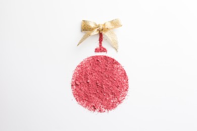 Photo of Christmas ball made of blush with bow on white background, top view