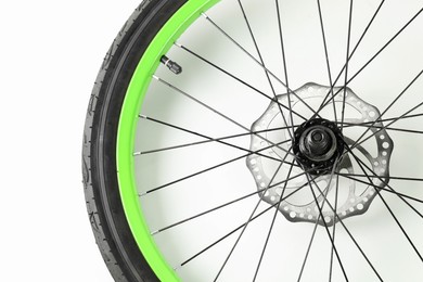 Bicycle wheel with tire on white background, top view