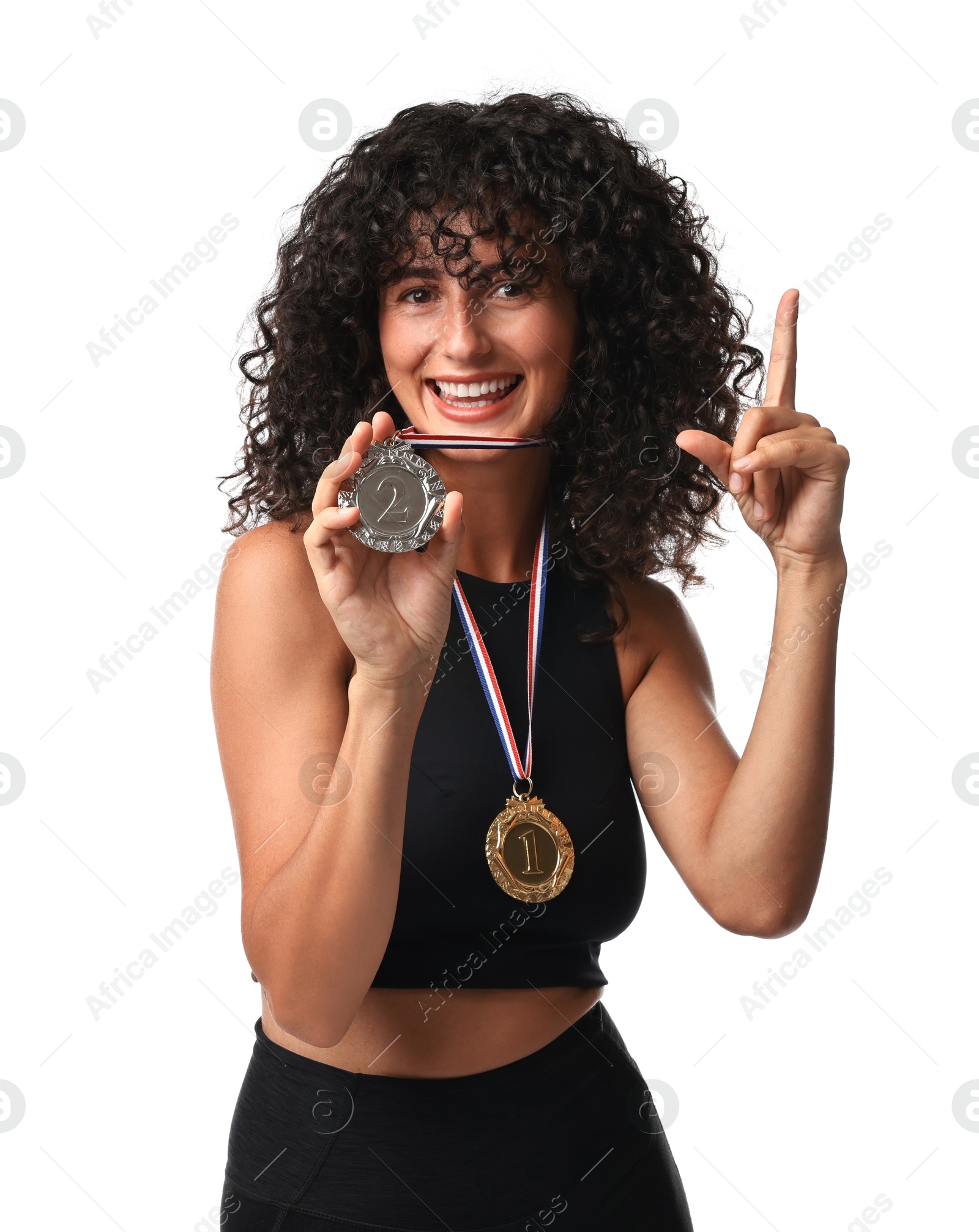 Photo of Happy winner with different medals pointing upwards on white background