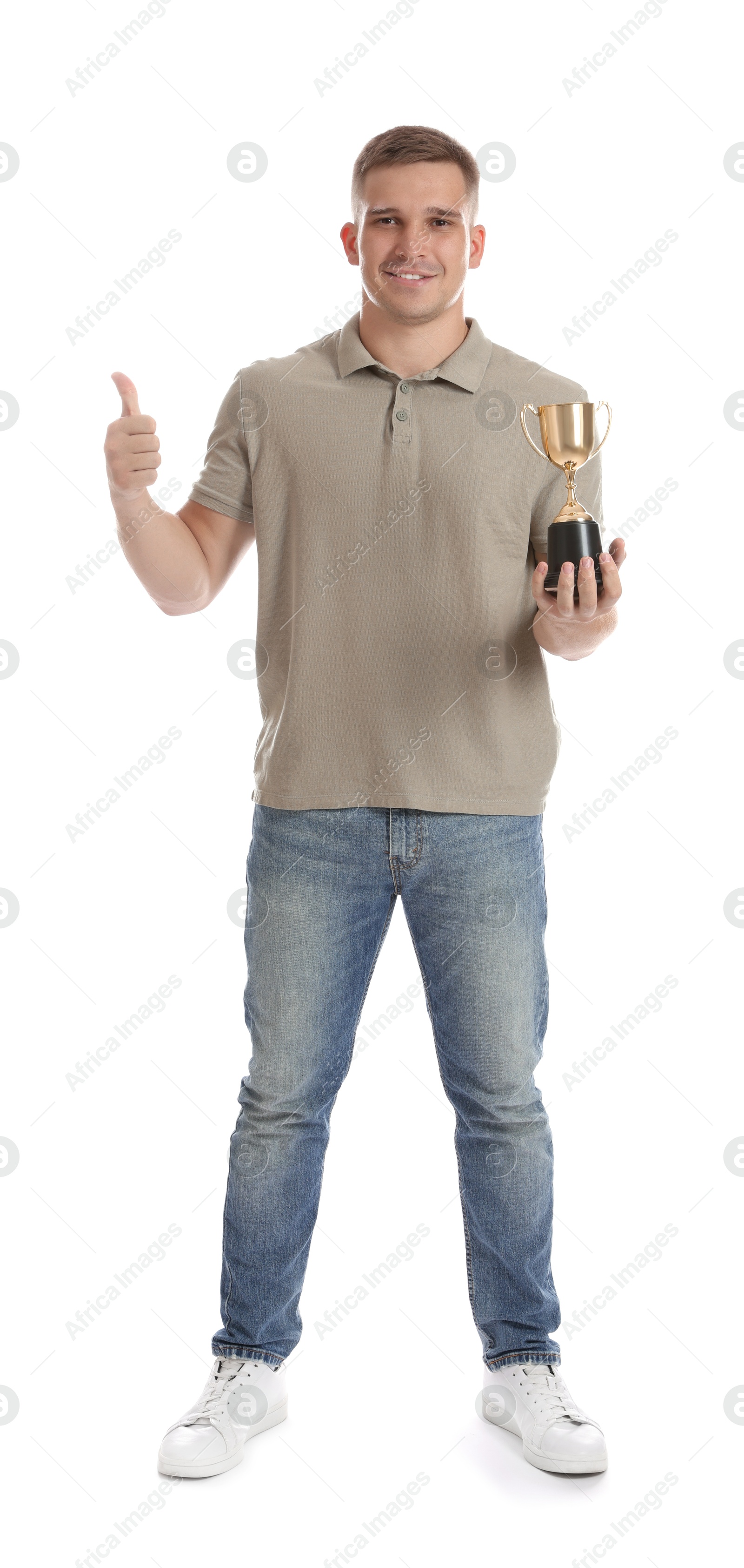 Photo of Happy winner with golden trophy cup showing thumbs up on white background