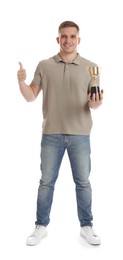 Happy winner with golden trophy cup showing thumbs up on white background