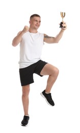 Photo of Happy winner with golden trophy cup on white background