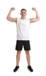 Photo of Happy winner showing his biceps on white background