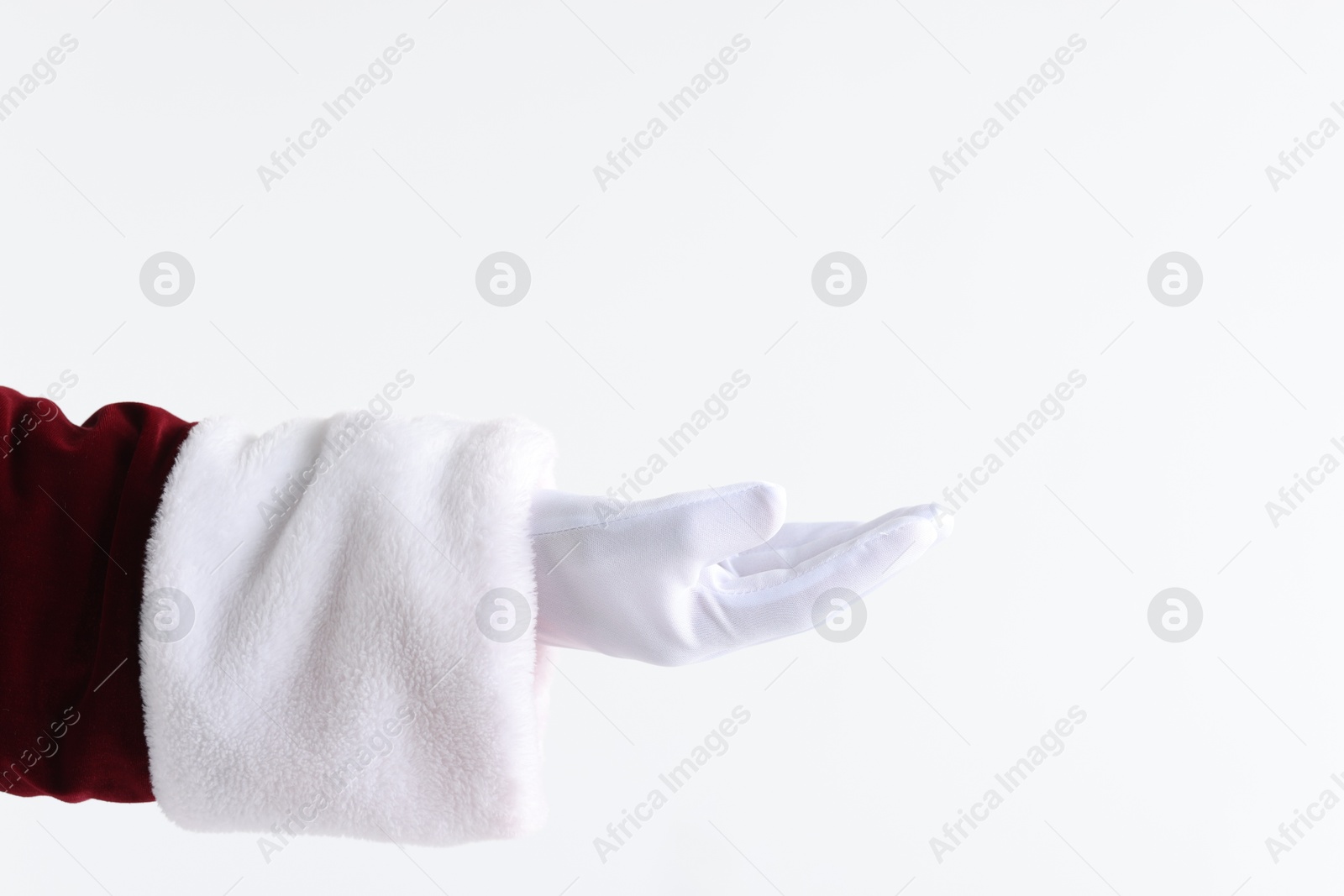 Photo of Santa Claus holding something on white background, closeup. Space for text