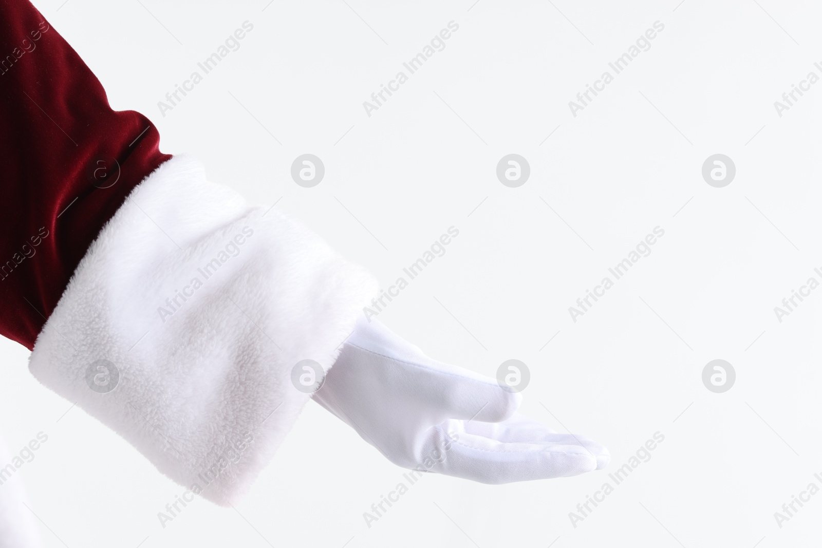 Photo of Santa Claus holding something on white background, closeup. Space for text