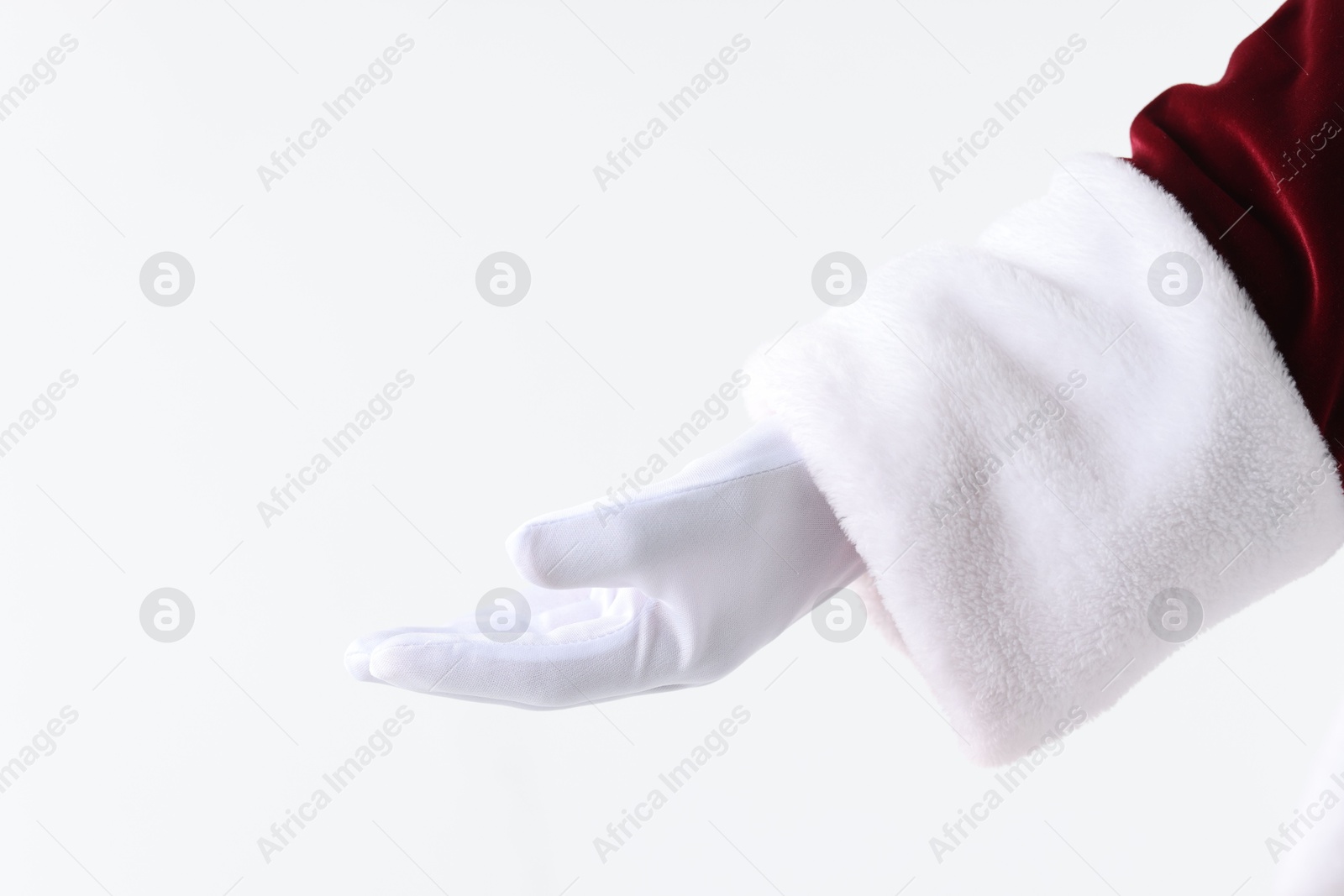 Photo of Santa Claus holding something on white background, closeup. Space for text