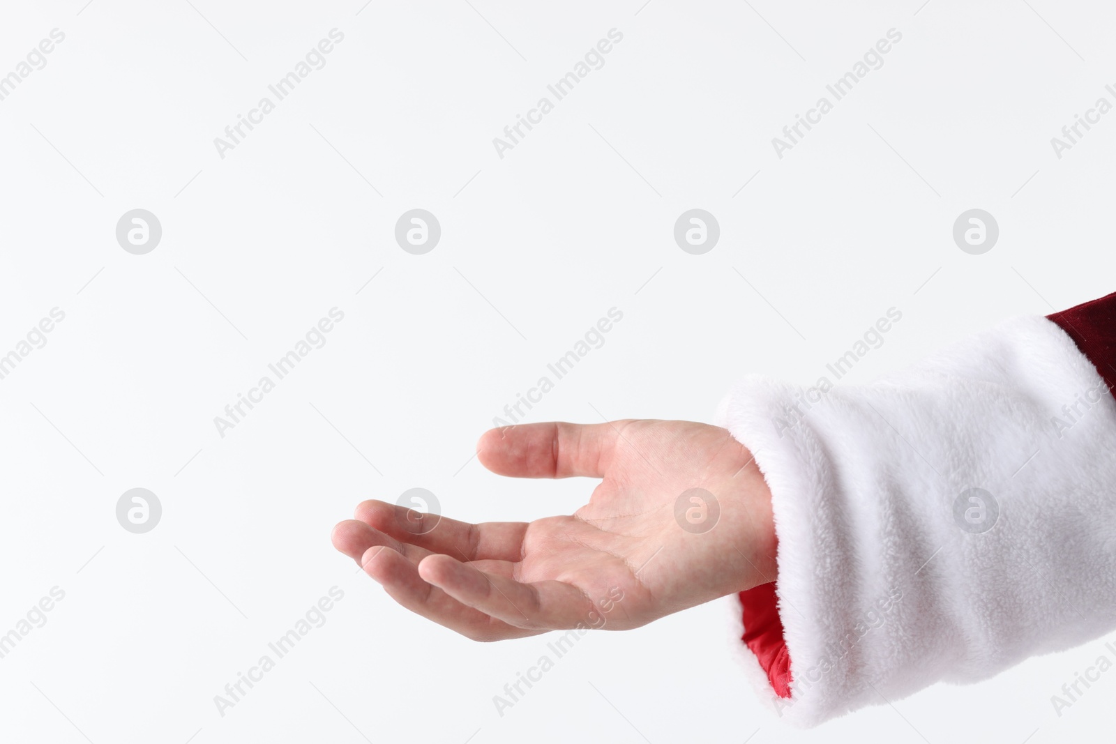 Photo of Santa Claus holding something on white background, closeup. Space for text