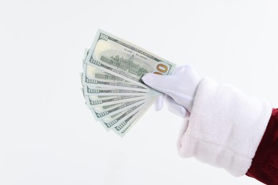 Santa Claus holding dollar banknotes on white background, closeup