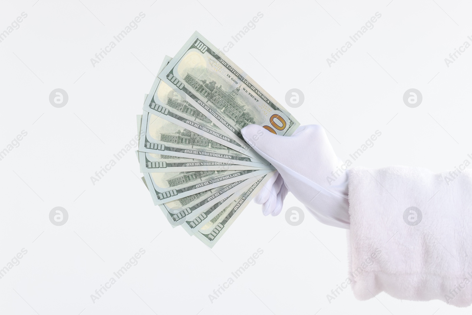 Photo of Santa Claus holding dollar banknotes on white background, closeup