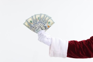 Photo of Santa Claus holding dollar banknotes on white background, closeup