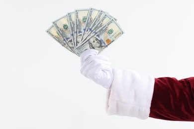 Photo of Santa Claus holding dollar banknotes on white background, closeup