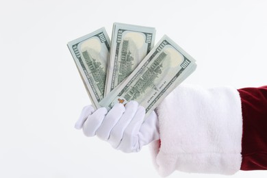 Santa Claus holding dollar banknotes on white background, closeup