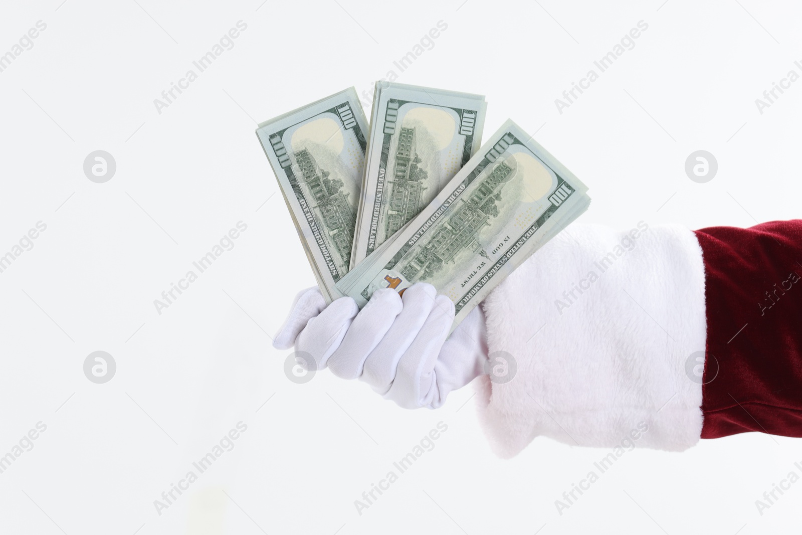 Photo of Santa Claus holding dollar banknotes on white background, closeup. Space for text